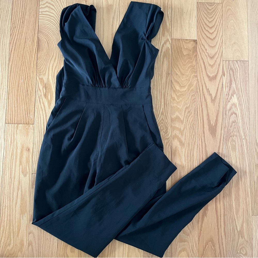 Bebe black jumpsuit with a tie back